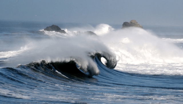 breaking waves....not ideal for diving.